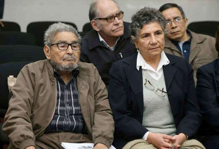 Shining Path leftist guerrilla group historic leader Abimael Guzman (L) and his wife Elena Yparraguirre listening to the life sentence at a court hearing
