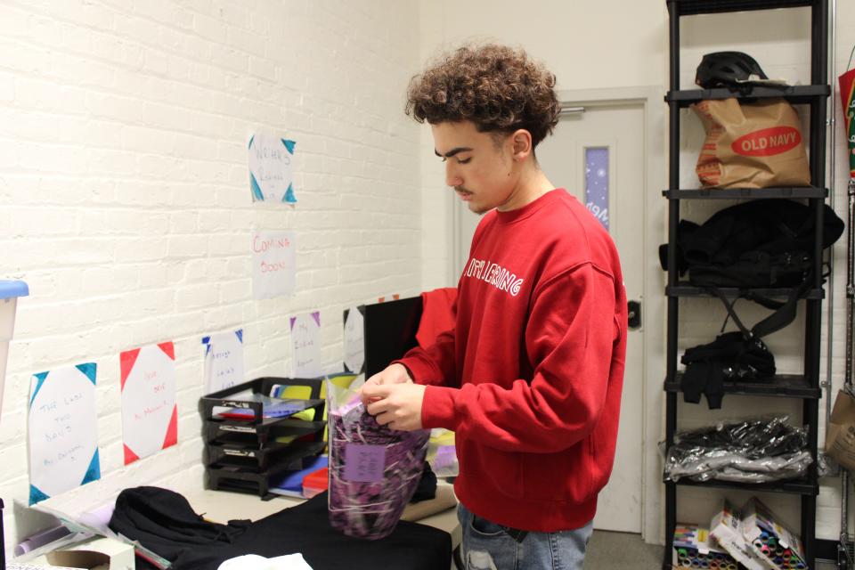 Bradley Hunter, a student who attends the TRAC program, works on a sweatshirt design for his clothing brand Mutual Emotions at “The Lab” design studio at the Family Partnership Center in the City of Poughkeepsie on December 20, 2023. Mutual Emotions is a clothing Brand that Hunter and his friends have developed through the TRAC Program.