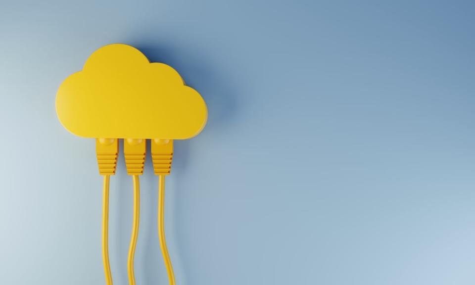An image of a yellow cloud against a blue background, with networking wires attached to the cloud.