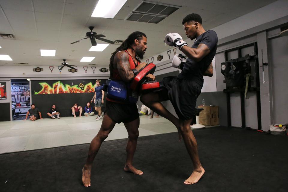 Fighter Eddie Lomonte, right, works on his striking with trainer Muhsin Corbbrey at Champions Training Center on Thursday, July 21, 2022