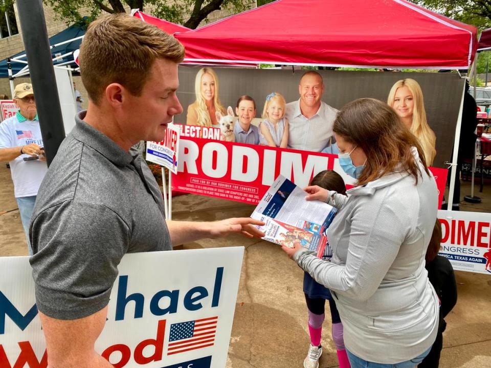 Fort Worth Republican District 6 candidate Michael Wood, a critic of former President Donald Trump, talks to a voter at the Mansfield subcourthouse.