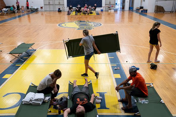 The Stivers family rest on cots, in the Hazard Community & Technical College, where survivors of the major flooding in eastern Kentucky are being taken for shelter on July 28, 2022, in Breathitt County, Kentucky.