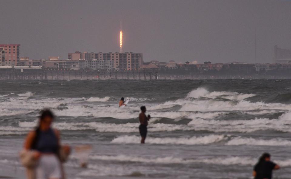 Many beach-goers in Cocoa Beach were oblivious to Sunday's SpaceX launch that disappeared into the clouds moments after liftoff from Launch Complex 40 at Cape Canaveral Space Force Station.