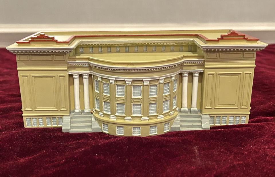 A replica of the former Petersburg High School, now the Appomattox Regional Governor's School for the Arts and Technology, adorns a table at the PHS 60s Mega Reunion IV in Virginia Beach in September 2023.