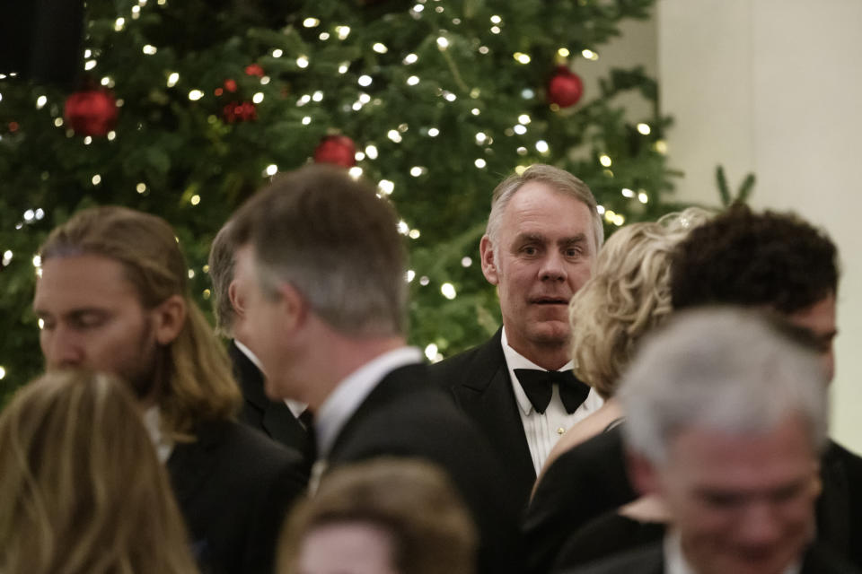 Secretary of the Interior Ryan Zinke attends the Congressional Ball in the Grand Foyer of the White House in Washington, Saturday, Dec. 15, 2018. (AP Photo/Carolyn Kaster)