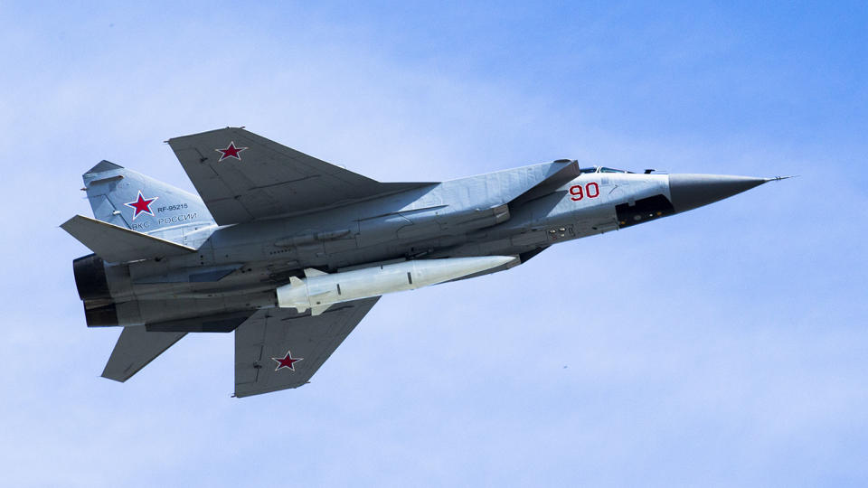 A Russian Air Force MiG-31K jet in 2018 carries a high-precision hypersonic aero-ballistic Kinzhal missile. (Alexander Zemlianichenko/AP)