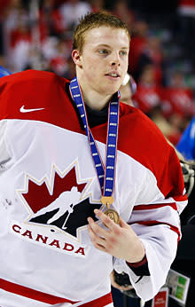 Mark Visentin holding the bronze medal at the World Junior Hockey Championship in Calgary