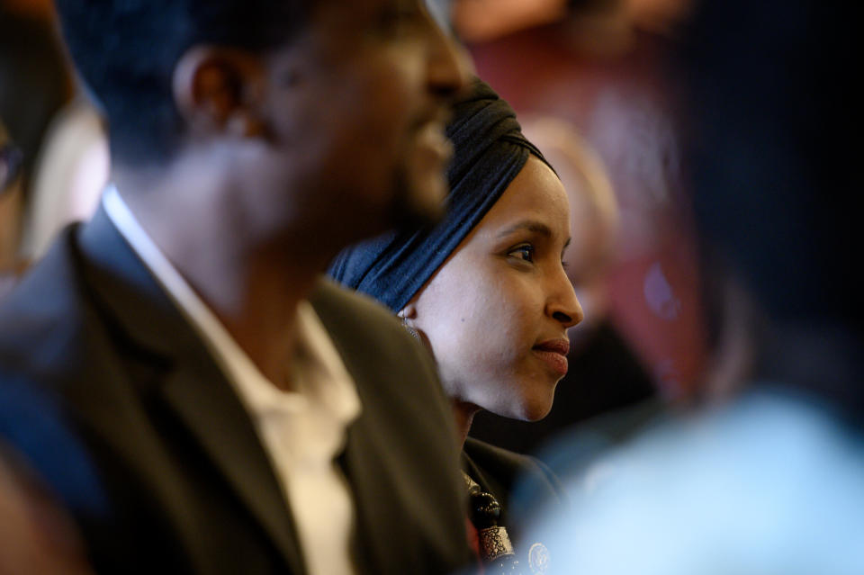 Omar listens to a speaker during the Paycheck Fairness and Women's Workforce Development Town Hall in Minneapolis. (Photo: Caroline Yang for HuffPost)