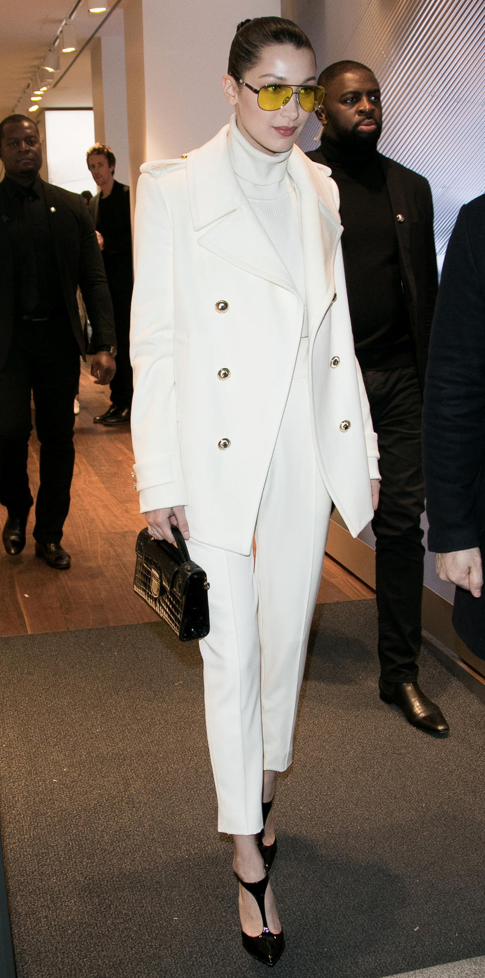 <p>Hadid rocked a clean silhouette while shopping in Paris, offsetting her monochromatic look with yellow-tinted aviators (shop a similar style <a rel="nofollow noopener" href="http://click.linksynergy.com/fs-bin/click?id=93xLBvPhAeE&subid=0&offerid=460292.1&type=10&tmpid=20904&RD_PARM1=http%3A%2F%2Fus.asos.com%2Fasos%2Fasos-metal-aviator-sunglasses-in-silver-with-yellow-colored-lens%2Fprd%2F7300332%3Fiid%3D7300332%2526transaction_id%3D102071ea925ebaf0725ebd8f2aaea1%2526affid%3D14329%2526pubref%3D1015%2526istCompanyId%3D467dd896-9a62-42c2-84d9-be2d13921f66%2526istItemId%3Dxiqpaixrla%2526istBid%3Dt&u1=ISBellaSSShadesIJMarch" target="_blank" data-ylk="slk:here;elm:context_link;itc:0;sec:content-canvas" class="link ">here</a>).</p>