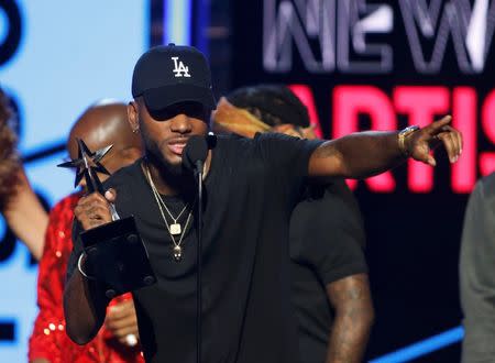 Bryson Tiller accepts the award for Best New Artist at the 2016 BET Awards in Los Angeles, California, U.S., June 26, 2016. REUTERS/Danny Moloshok