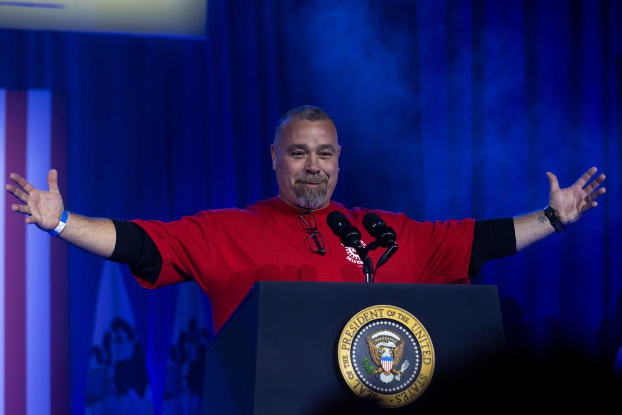 UAW Local 1268 President Matt Frantzen puts his arms up in celebration Thursday, Nov. 9, 2023, in Belvidere, Illinois, during an event to support the United Auto Workers of America reaching an agreement with automaker Stellantis.