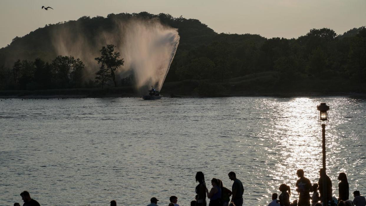 <div>GRAND HAVEN, MI - AUGUST 5: People gather at the waterfront on August 5, 2023 in anticipation of a fireworks display during a festival in Grand Haven, Michigan. The city held its first Pride festival earlier this year. (Photo by Bonnie Jo Mount/The Washington Post via Getty Images)</div>