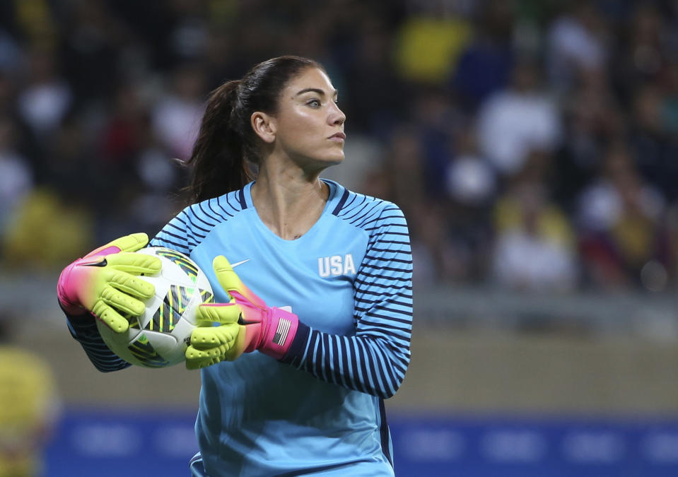 FILE - In this Aug. 3, 2016, file photo, United States' goalkeeper Hope Solo takes the ball during a women's soccer game at the Rio Olympics against New Zealand in Belo Horizonte, Brazil. U.S. women's national team coach Jill Ellis has emphasized that Solo's suspension stemmed from a 'sum total of actions' and not just comments the goalkeeper made about Sweden during the Olympics. (AP Photo/Eugenio Savio, File)