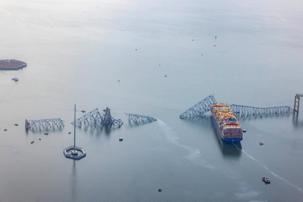 PHOTO: In an aerial view, the cargo ship Dali sits in the water after running into and collapsing the Francis Scott Key Bridge, Mar. 26, 2024, in Baltimore. (Tasos Katopodis/Getty Images)
