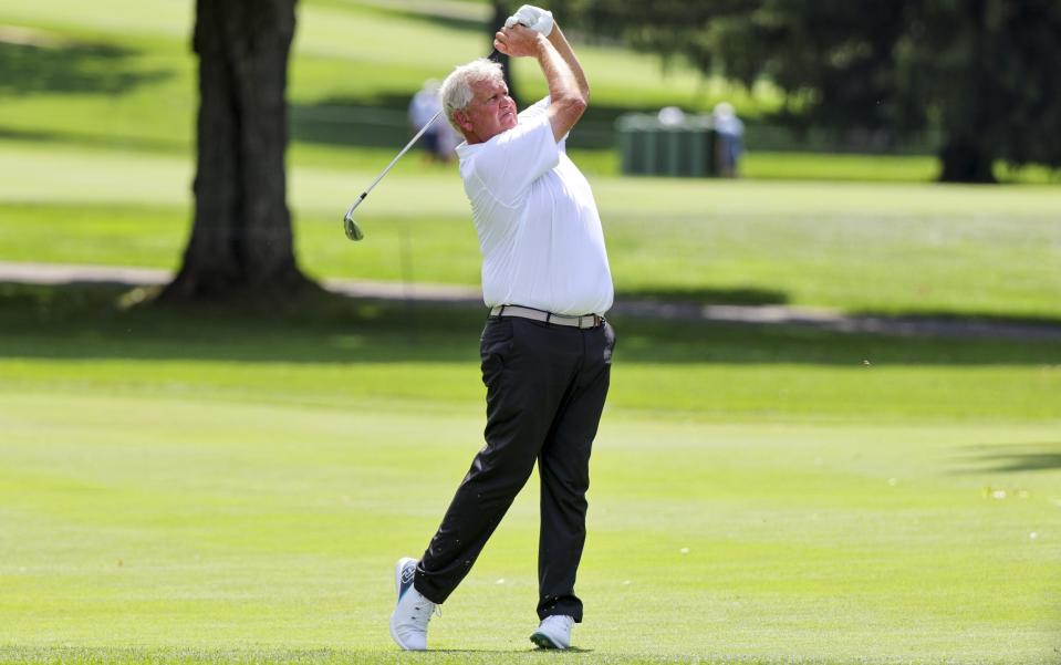 Colin Montgomerie of Scotland hits an approach shot on the ninth hole during the first round of the Kaulig Companies Championship