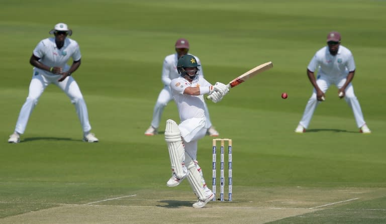 Pakistan nightwatchman Yasir Shah (C) plays a shot on the second day of the second Test against West Indies at the Sheikh Zayed Cricket Stadium in Abu Dhabi on October 22, 2016