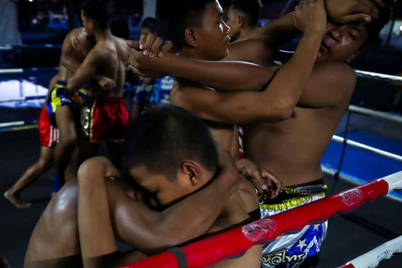 The Wider Image: Punching out of poverty: Despite risks, nine-year-old Thai fighter eager to return to ring