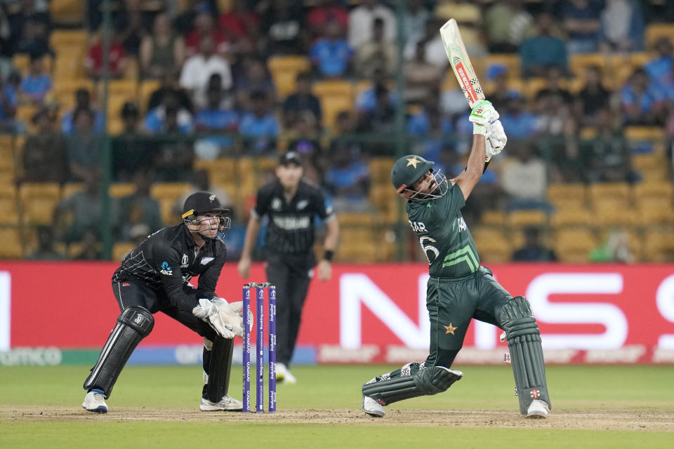 Pakistan's captain Babar Azam hits a six during the ICC Men's Cricket World Cup match between New Zealand and Pakistan in Bengaluru, India, Saturday, Nov. 4, 2023. (AP Photo/Aijaz Rahi)