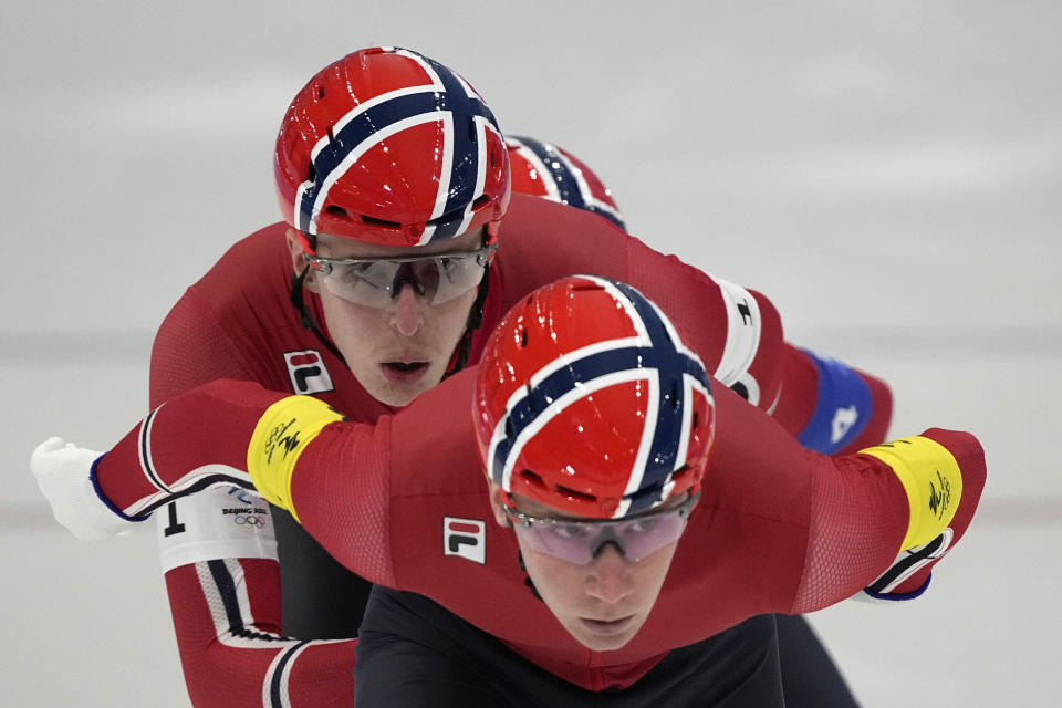 Team Norway, led by Peder Kongshaug, with Hallgeir Engebraaten center and Sverre Lunde Pedersen, competes during the speedskating men's team pursuit semifinals at the 2022 Winter Olympics, Tuesday, Feb. 15, 2022, in Beijing. (AP Photo/Ashley Landis)