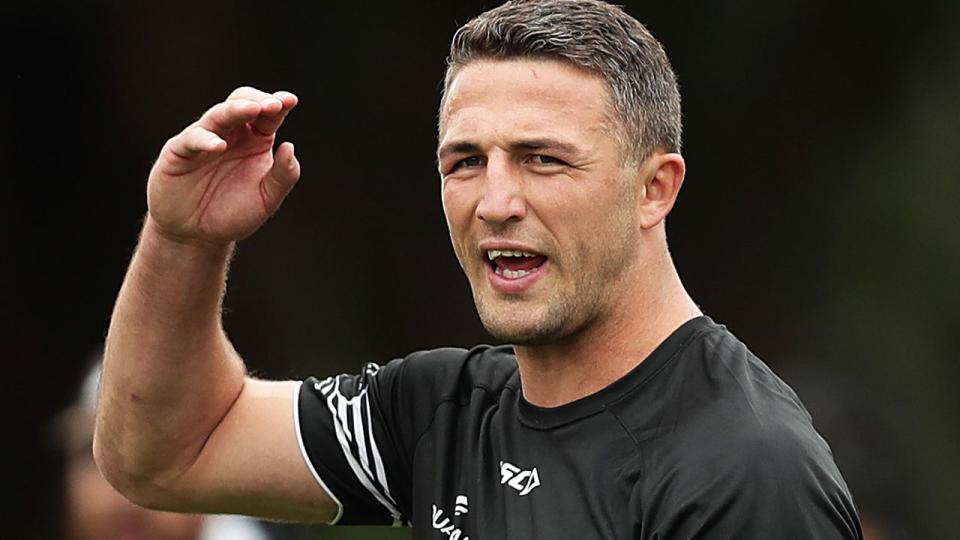 Sam Burgess is seen here talking to players at South Sydney training.