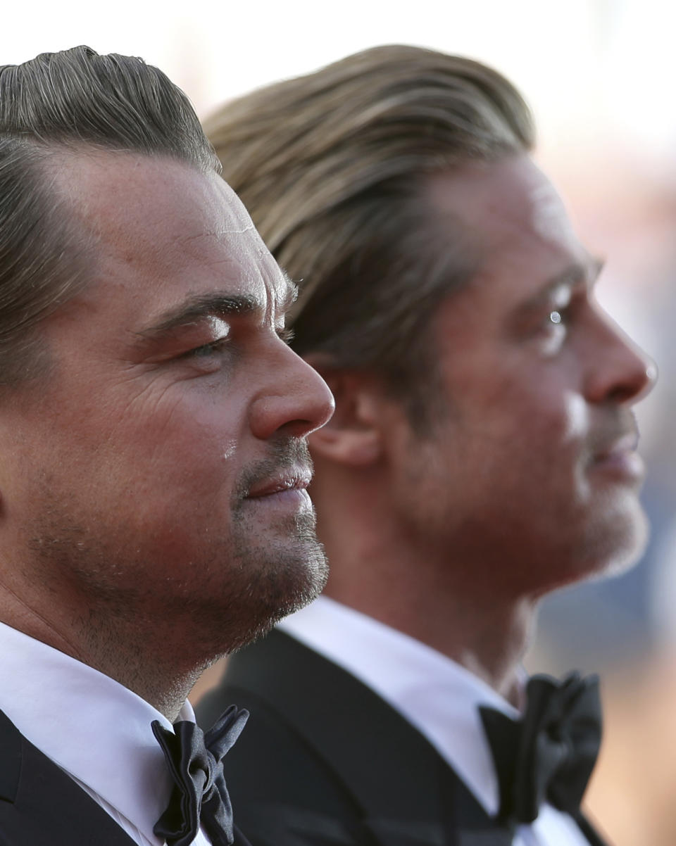 Actors Leonardo DiCaprio, left, and Brad Pitt pose for photographers upon arrival at the premiere of the film 'Once Upon a Time in Hollywood' at the 72nd international film festival, Cannes, southern France, Tuesday, May 21, 2019. (AP Photo/Petros Giannakouris)