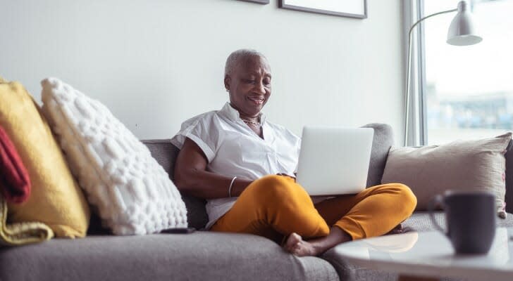 A retired woman checks her portfolio from her laptop. An expert from Morningstar argues that equities are far more important in retirement than bonds. 