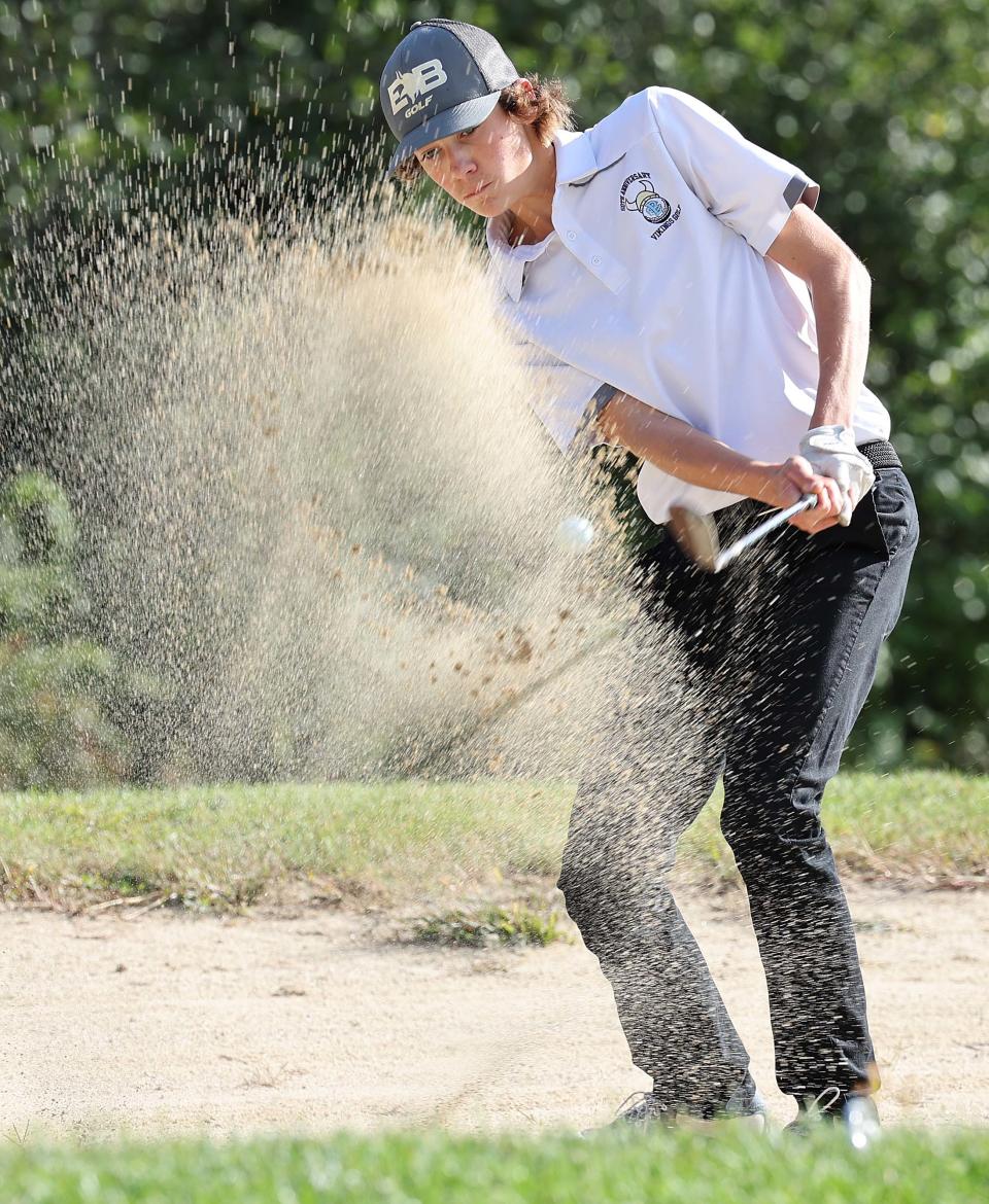 East Bridgewater's Cole Redder hits out of a sand trap at the Ridder Farm Golf Course during a match versus Abington on Thursday, Sept. 29, 2022.