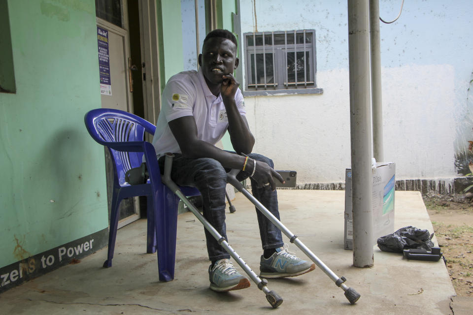 Wheelchair user Seme Lado Michael sits outside his office in Juba, South Sudan Friday, Jan. 13, 2023. When Pope Francis arrives in Congo and South Sudan next week, thousands of people will take special note of a gesture more grounded than the sign of the cross - watching from their wheelchairs, they will relate to the way he uses his. (AP Photo)