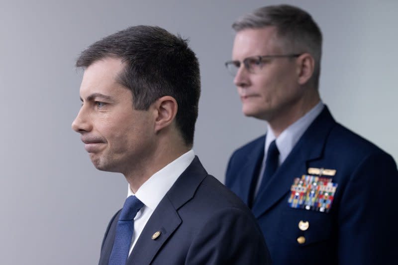 U.S. Secretary of Transportation Pete Buttigieg (L) and Deputy Commandant for Operations for the United States Coast Guard, Vice Admiral Peter Gautier participate in a news conference about the Baltimore bridge collapse Wednesday at the White House, in Washington, D.C. Photo by Michael Reynolds/UPI