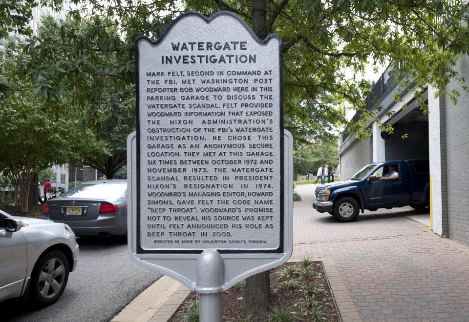 A historical marker on August 19, 2011 notes the parking garage in the Rosslyn neighborhood of Arlington, Virginia, where Washington Post reporter Bob Woodward met in secret with his source 'Deep Throat' (Senior FBI official Mark Felt) as Woodward investigated former US President Richard Nixon and the Watergate scandal in 1972 and 1973. The scandal ultimately lead to Nixon's resignation in 1974.    AFP PHOTO / Saul LOEB (Photo credit should read SAUL LOEB/AFP/Getty Images)