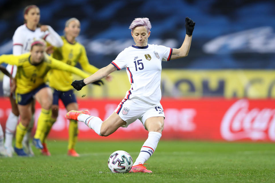 SOLNA, SWEDEN - APRIL 10: Megan Rapinoe of USA scores their team's first goal from a penalty during the Women's International Friendly between Sweden and USA at Friends Arena on April 10, 2021 in Solna, Sweden. Sporting stadiums around the Sweden remain under strict restrictions due to the Coronavirus Pandemic as Government social distancing laws prohibit fans inside venues resulting in games being played behind closed doors. (Photo by Linnea Rheborg/Getty Images)