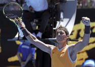 Spain's Rafael Nadal celebrates after defeating Australia's James Duckworth in their first round match at the Australian Open tennis championships in Melbourne, Australia, Monday, Jan. 14, 2019. (AP Photo/Aaron Favila)