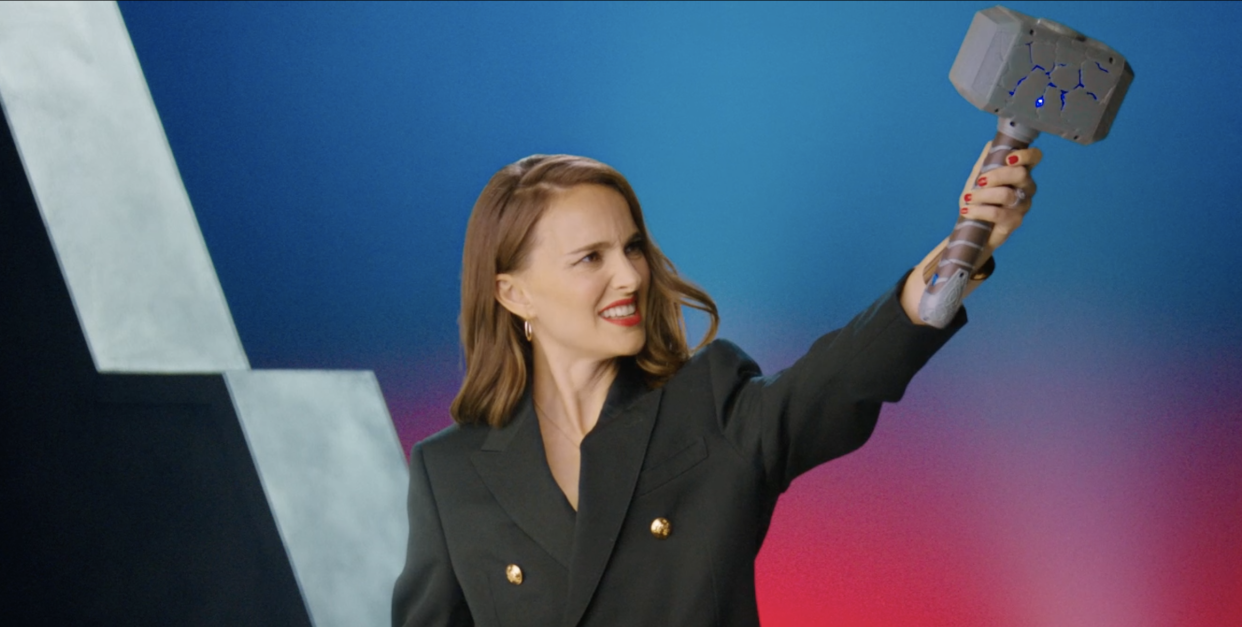 Natalie Portman wields a toy version of Thor's hammer in an exclusive unboxing video. (Photo: Disney)