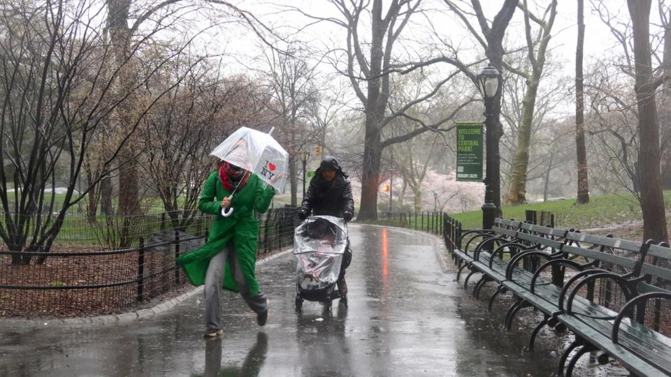 PHOTO: People leave Central Park during a rainstorm in New York City, Apr. 3, 2024. (Gary Hershorn/ABC News)