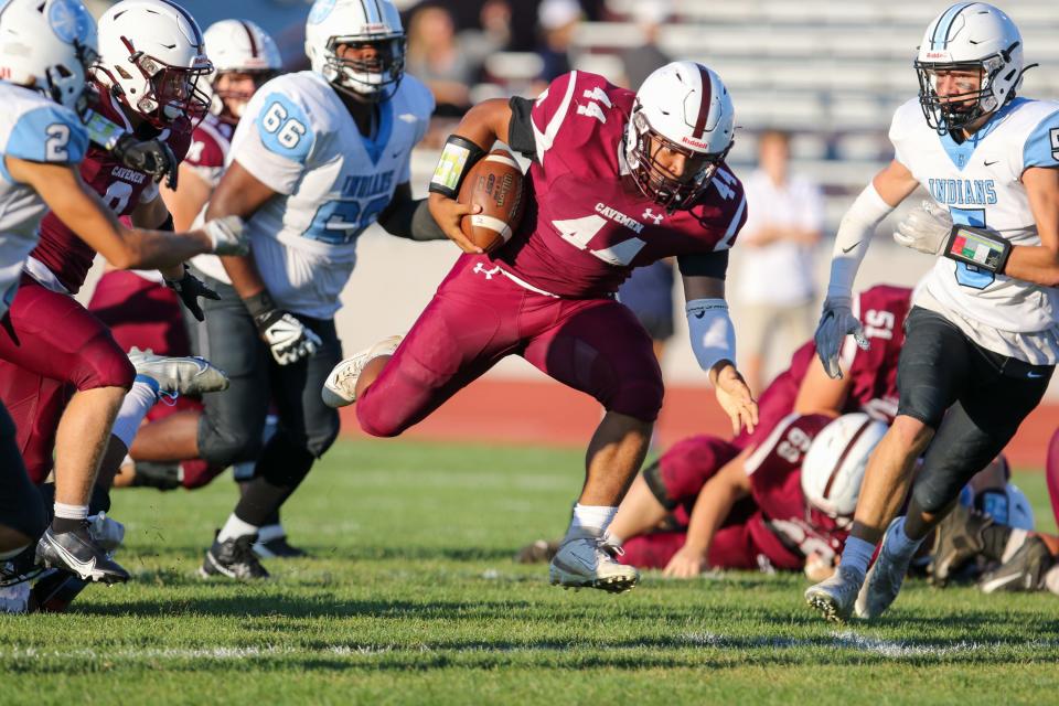 Mishawaka’s Chase Gooden (44) finds some running room during Friday night’s game against Saint Joseph at Mishawaka.