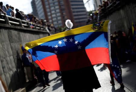 Opposition supporters attend a rally to pay tribute to victims of violence during protests against Venezuelan President Nicolas Maduro's government in Caracas, Venezuela, July 24, 2017. REUTERS/Ueslei Marcelino