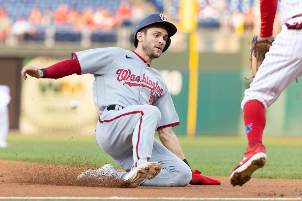 Trea Turner slides safely into third base in the top of the first inning against the Phillies in Tuesday's game at Citizens Bank Park.