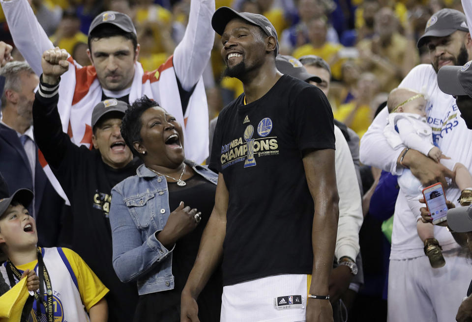 Golden State Warriors forward Kevin Durant celebrates with his mother Wanda Durant as he is named the NBA Finals Most Valuable Player. (AP)