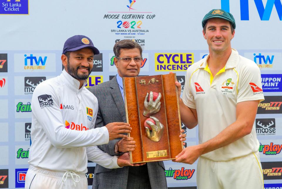 Dimuth Karunaratne and Pat Cummins, pictured here with the Warne-Muralitharan trophy after drawing their series 1-1.