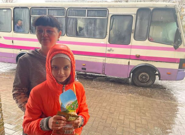 PHOTO: Alina Ivanchenko, 40, and her daughter, Zlata, prepare to depart Kostyantynivka on an evacuation bus, on April 20, 2023. (ABC News)