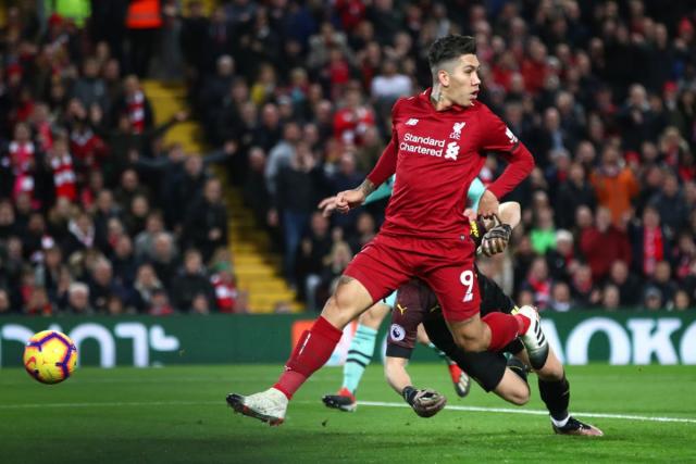 Firmino scores with a trademark &#x002018;no-look&#x002019; finish against Arsenal in December 2018 - his favourite Liverpool game (Getty Images)