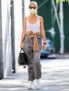 <p>Gwyneth Paltrow wraps a sweater around her waist while out and about in N.Y.C. on Thursday. </p>