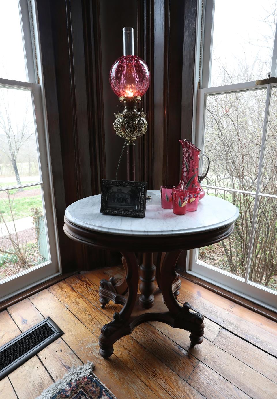 A hand-painted lemonade set on marble top table inside the family parlor in the Riverview at Hobson Grove Historic House Museum in Bowling Green, Ky. on Mar. 19, 2023.  It was the home of Atwood Gaines Hobson and Julia VanMeter Hobson in 1872.