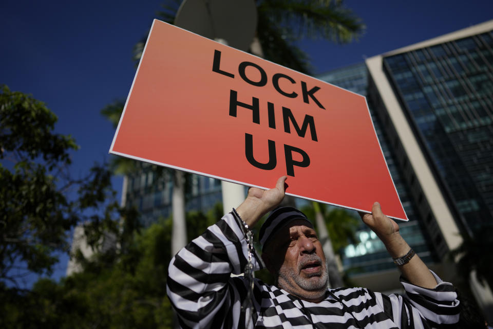 Domenic Santana stands outside the Wilkie D. Ferguson Jr. U.S. Courthouse, Tuesday, June 13, 2023, in Miami. Former President Donald Trump is making a federal court appearance today on dozens of felony charges accusing him of illegally hoarding classified documents and thwarting the Justice Department's efforts to get the records back.(AP Photo/Rebecca Blackwell)