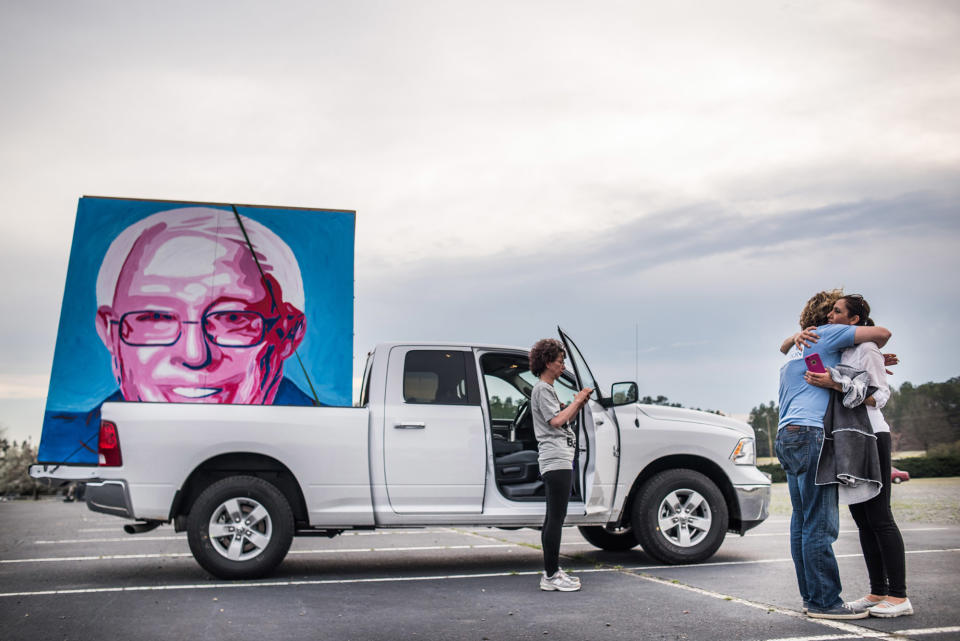 <p>Joseph Kelly hugs Farzaneh Rezaei after loading his large painting of Bernie Sanders into a truck following a rally in Charlotte, N.C., March 14, 2016. (Sean Rayford/Getty Images) </p>