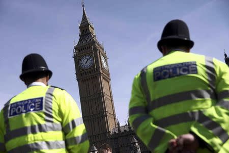 Police officers patrol in Parliament Square following the attack in Westminster earlier in the week, in central London, Britain March 26, 2017. REUTERS/Neil Hall