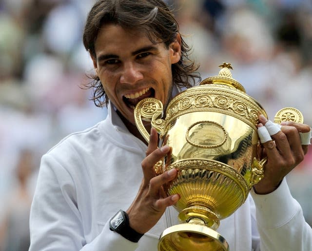 Rafael Nadal bites the Wimbledon trophy