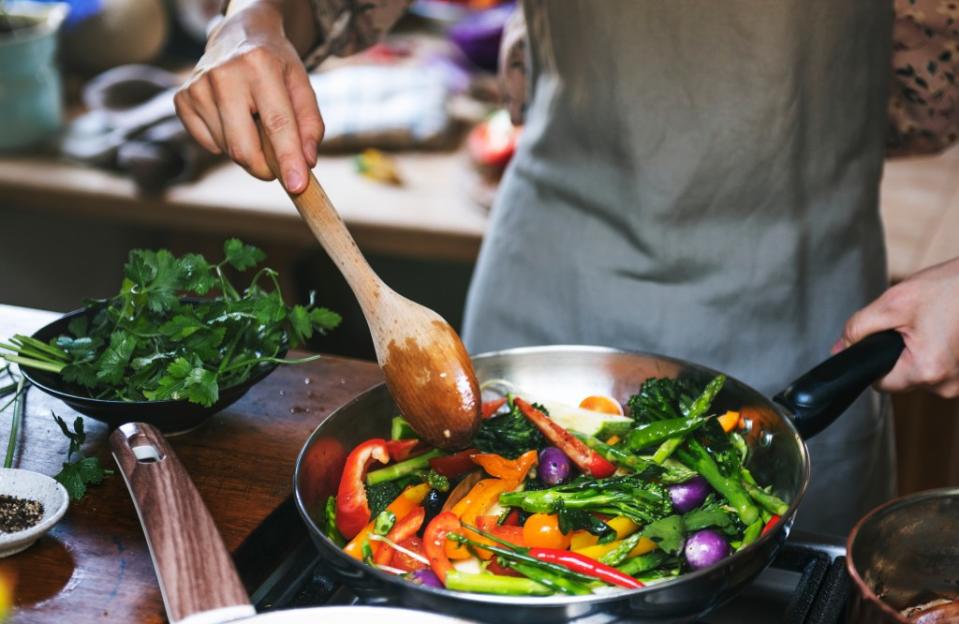 Cooking a healthy meal at home is a one-two punch of stress relief. Rawpixel.com – stock.adobe.com