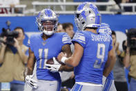 Detroit Lions wide receiver Marvin Jones (11) is greeted by quarterback Matthew Stafford (9) after a 10-yard reception for a touchdown during the first half of an NFL football game against the Minnesota Vikings, Sunday, Oct. 20, 2019, in Detroit. (AP Photo/Rick Osentoski)