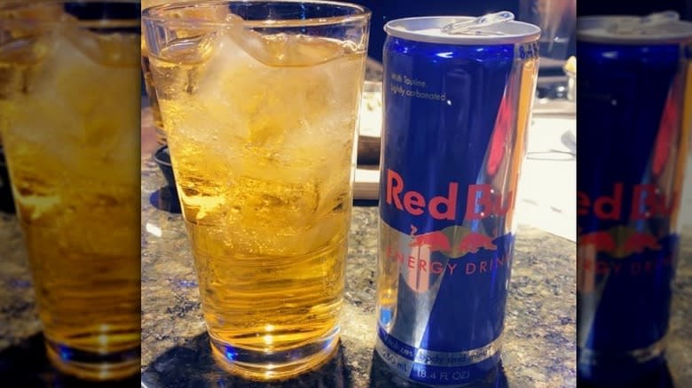 glass vodka Red Bull and can